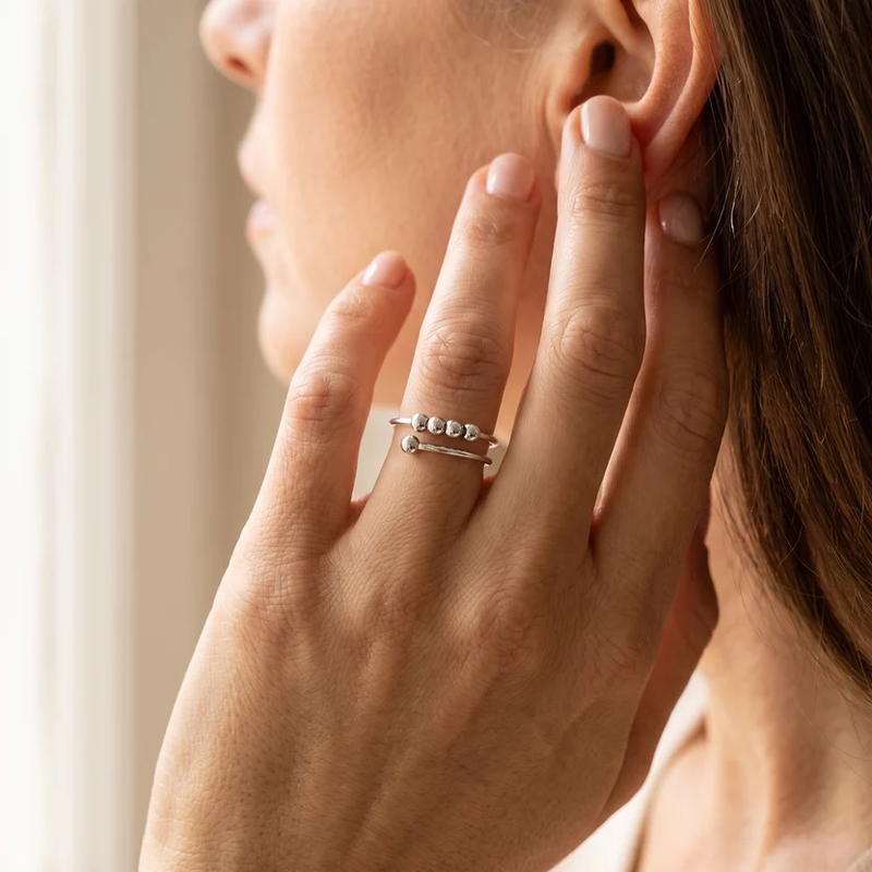 Cuff Ring with four beads, in silver, worn on the hand