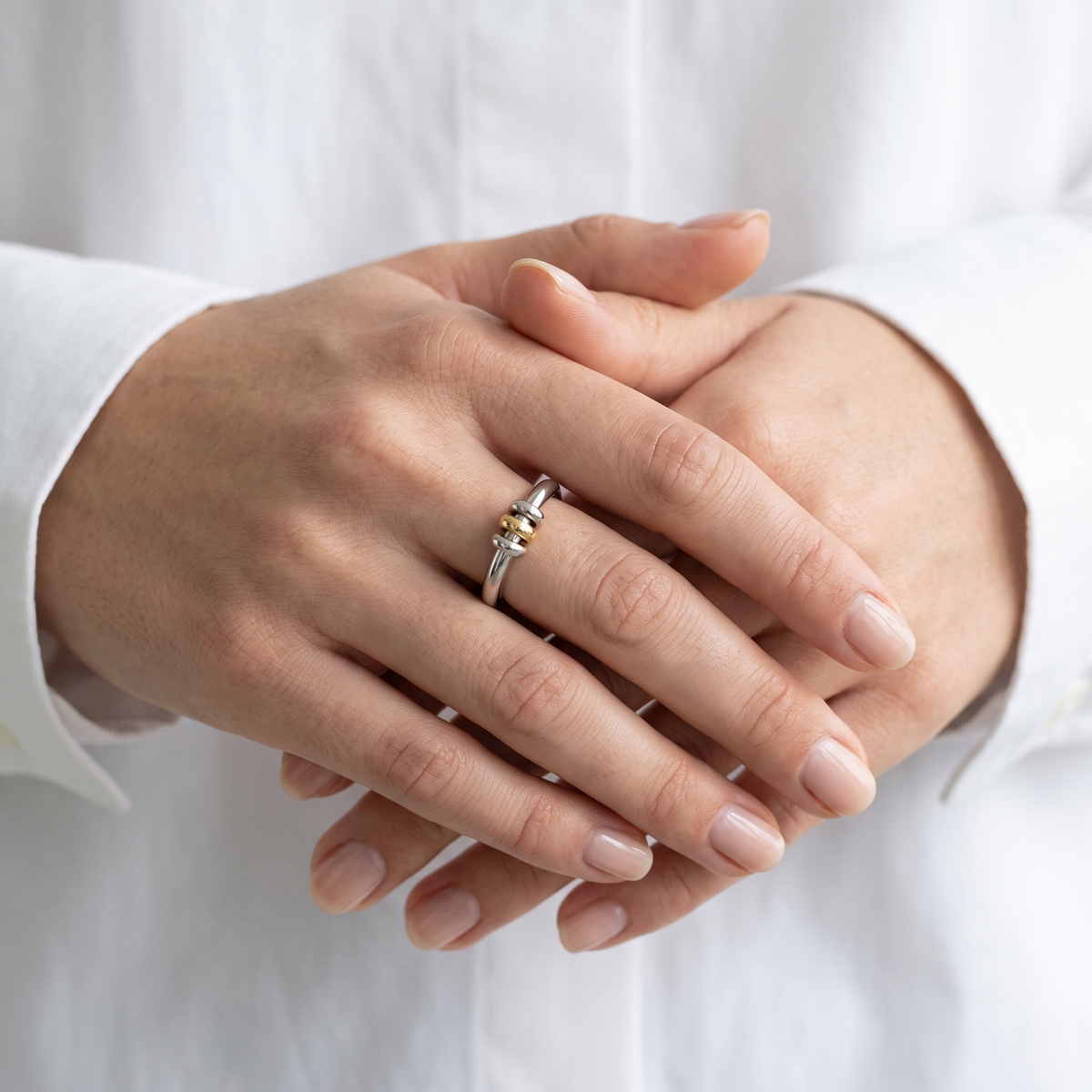 Arc Ring in gold and silver, worn on the hand