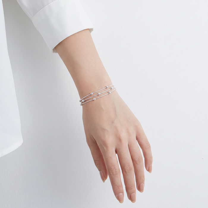 Snake Bracelet, Triple Layer in silver, worn on the wrist