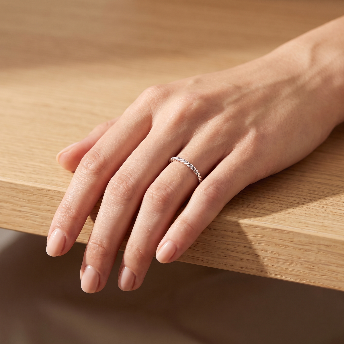 Twist Ring in silver, worn on the hand