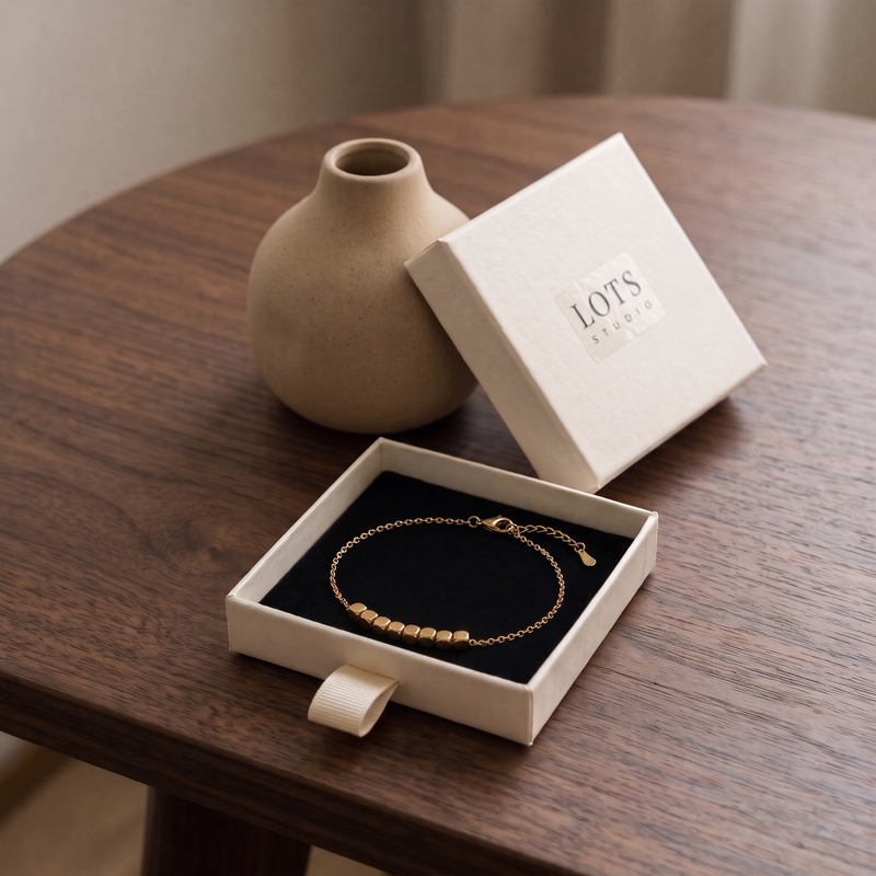 Block Bracelet in the LOTS Studio gift box, its eight blocks on a fine chain