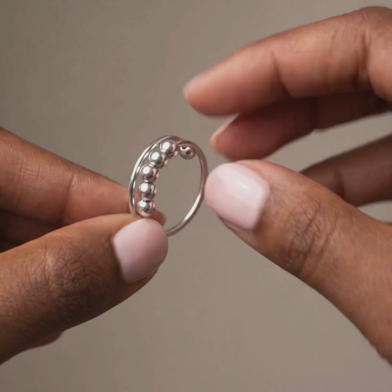 Cuff Ring, the beads moving along the open band